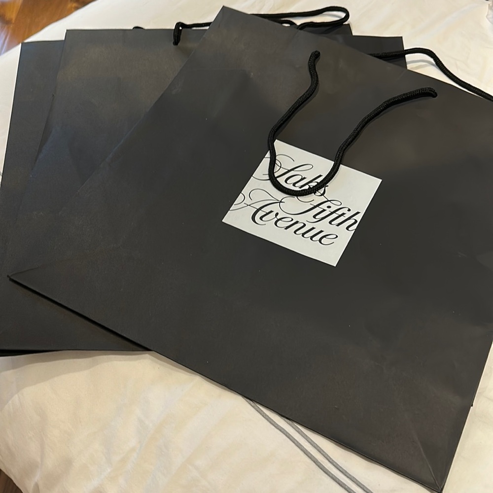 Set of three paper bags. Good condition.